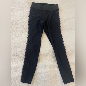 Black cut out leggings with piercing details on side